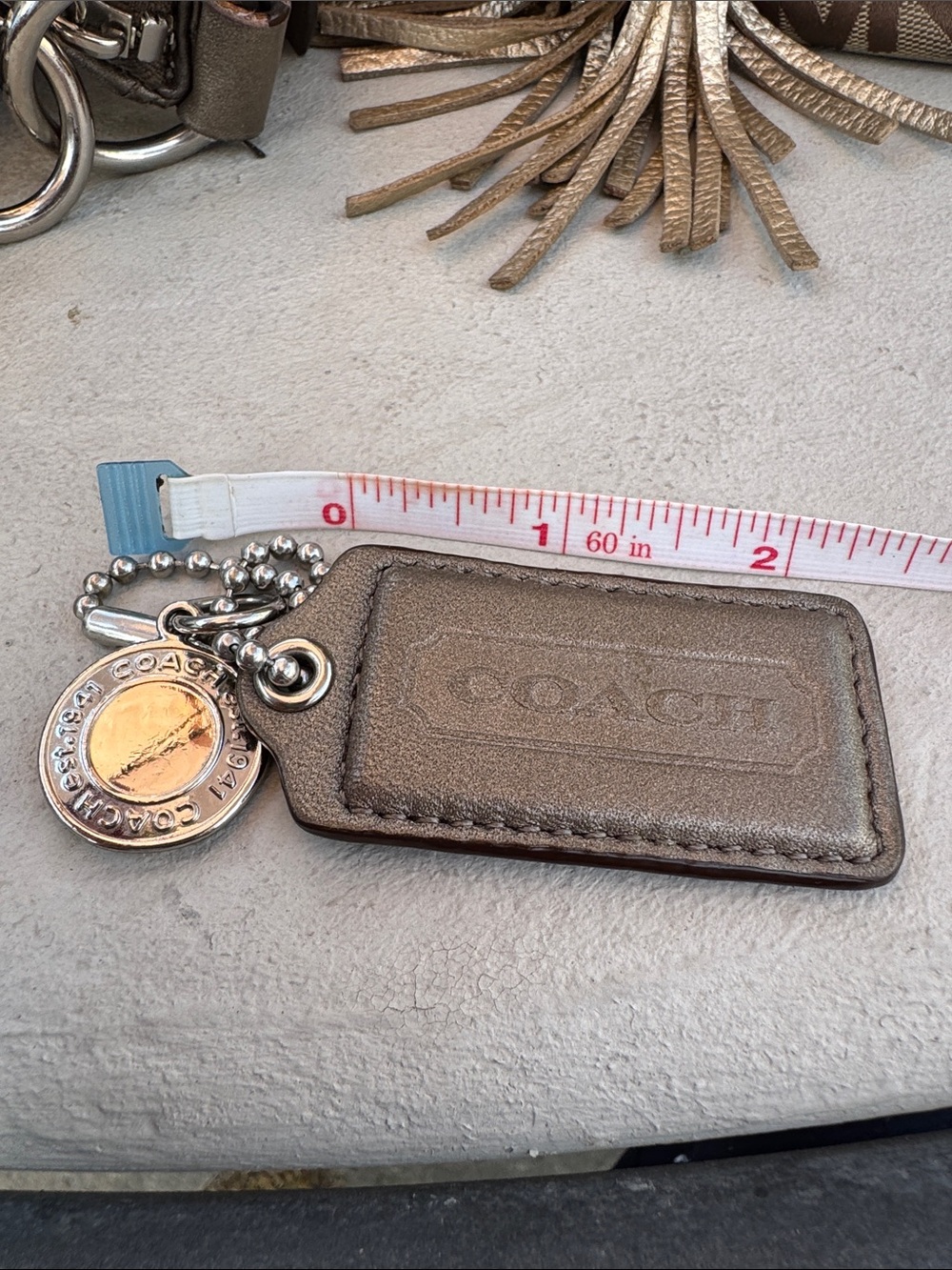 Coach Metallic Bronze Leather Bag Tag with Coin Charm